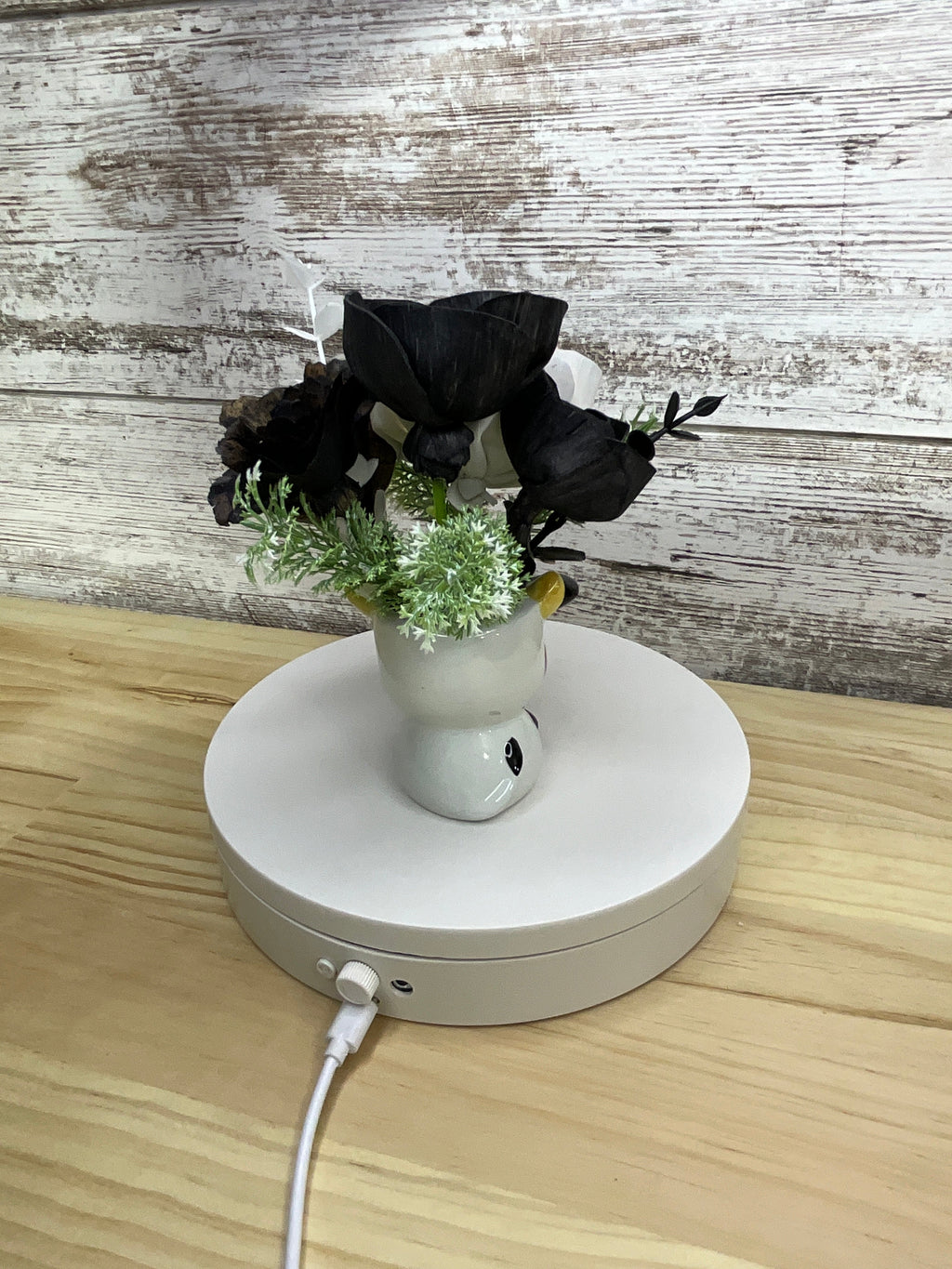 Black & White Sola Wood Flower Arrangement in Cow Ceramic Mini Mug