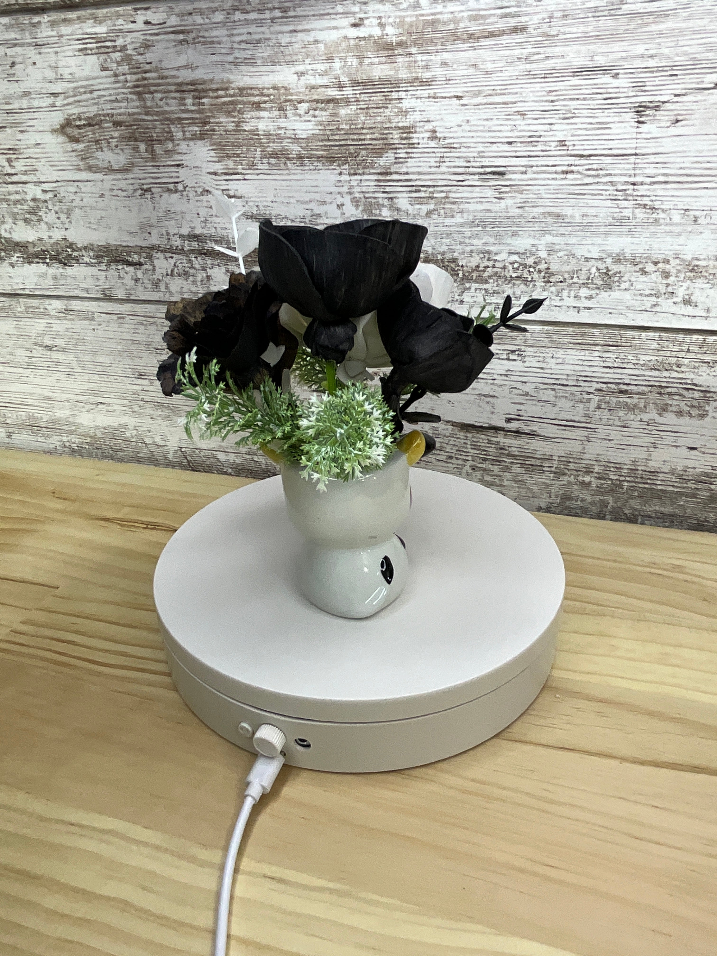 Black & White Sola Wood Flower Arrangement in Cow Ceramic Mini Mug