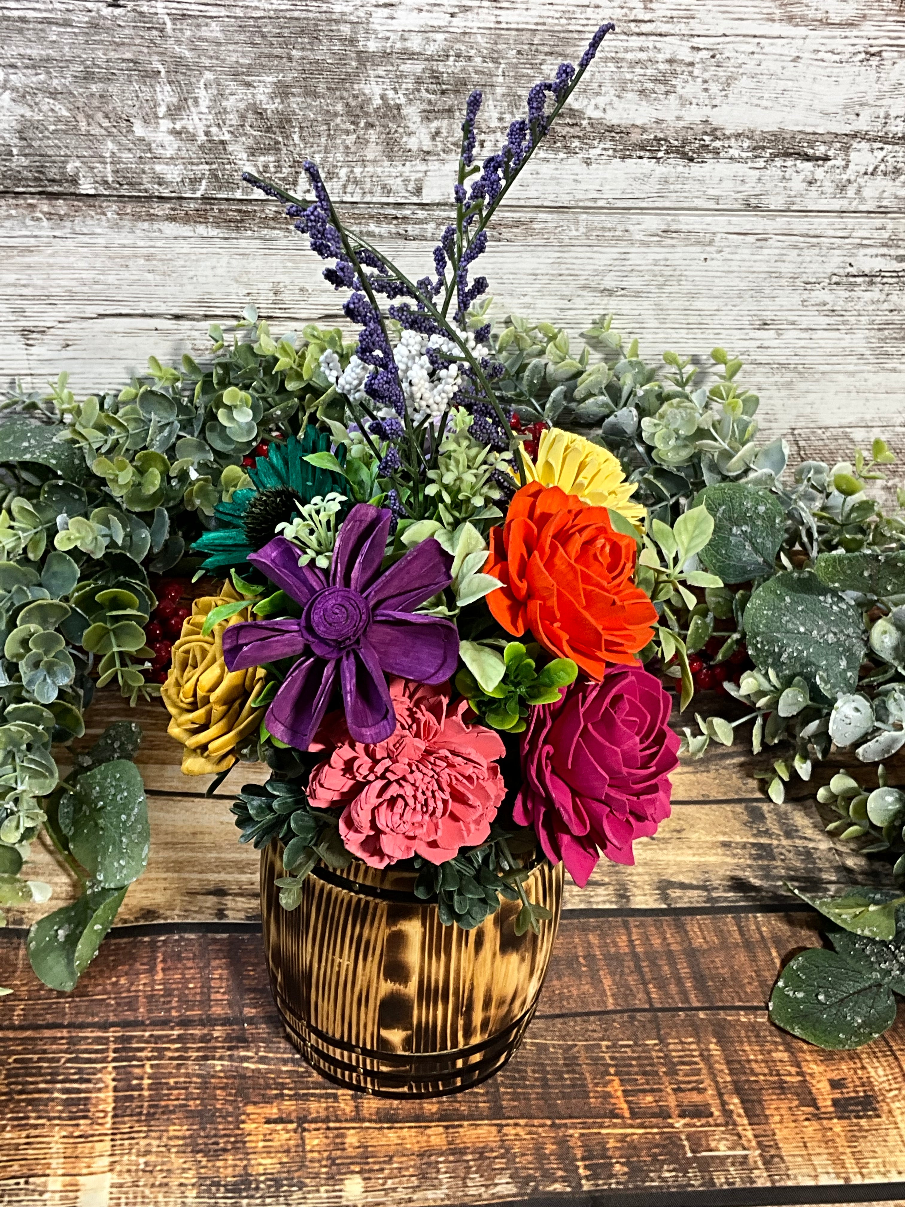 Vibrant Rainbow Sola Wood Flower Arrangement in Oak Stained Whiskey Barrel