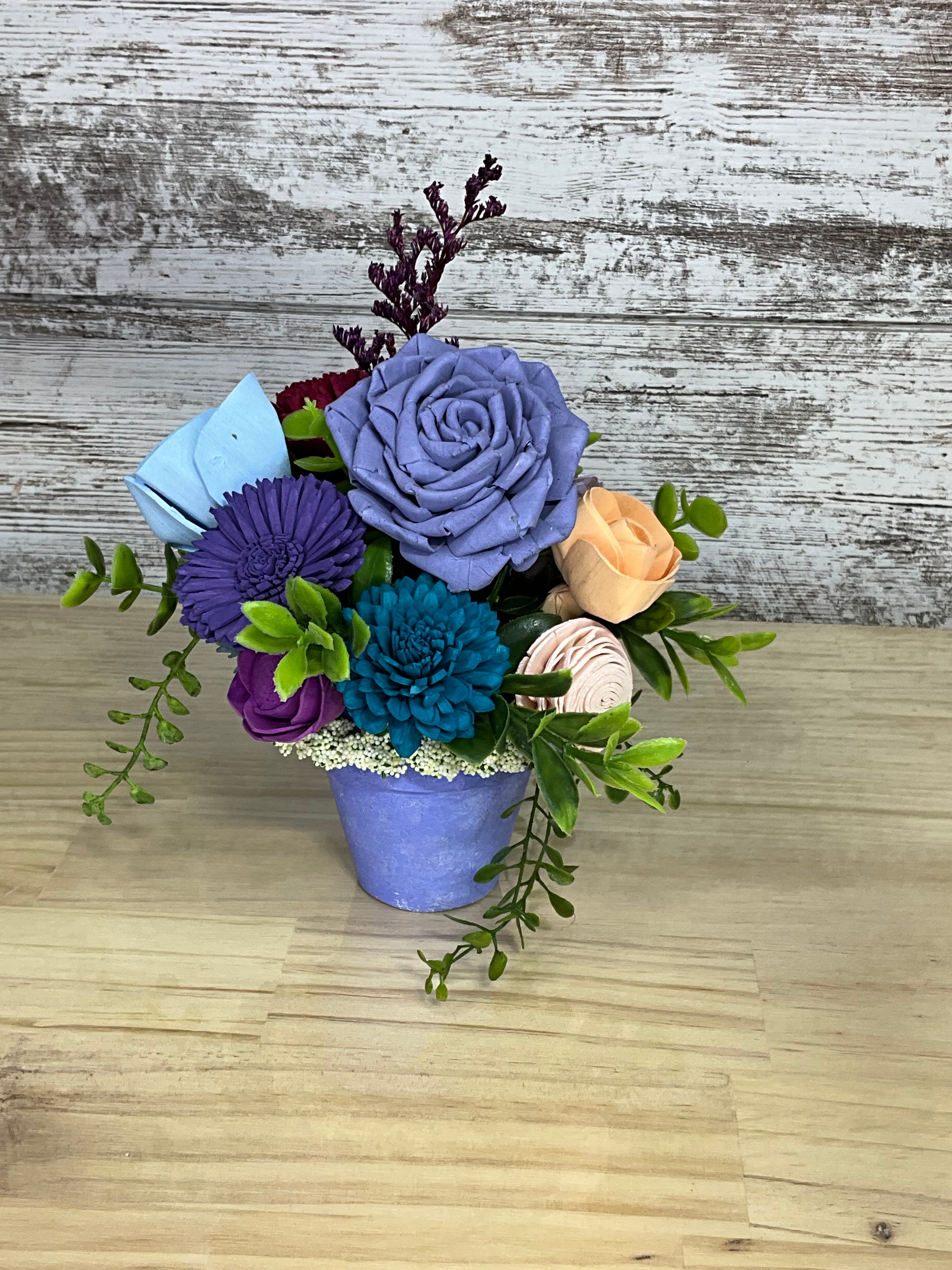 Sola Wood Flower Arrangement in Purple Terracotta Pot