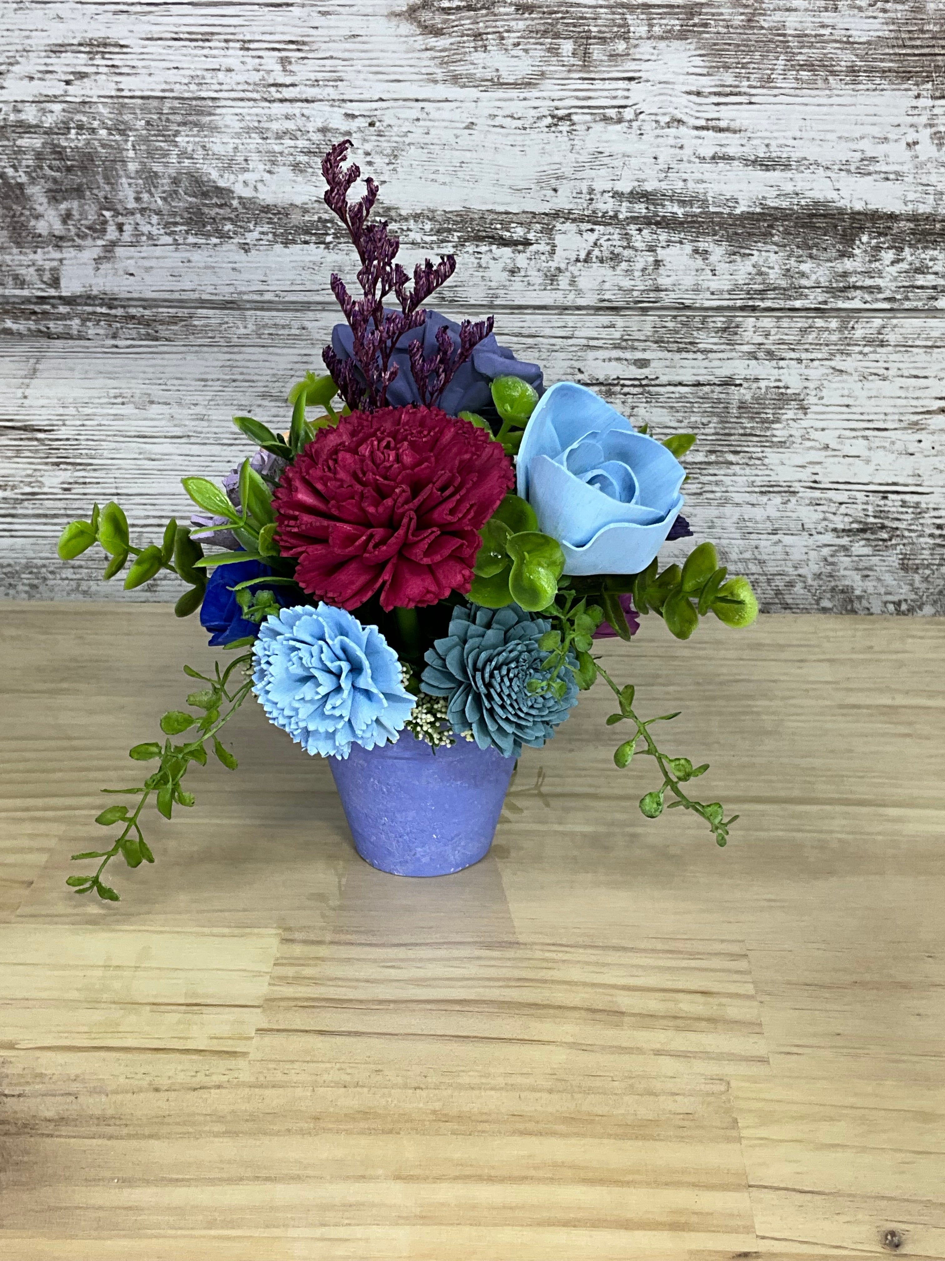 Sola Wood Flower Arrangement in Purple Terracotta Pot