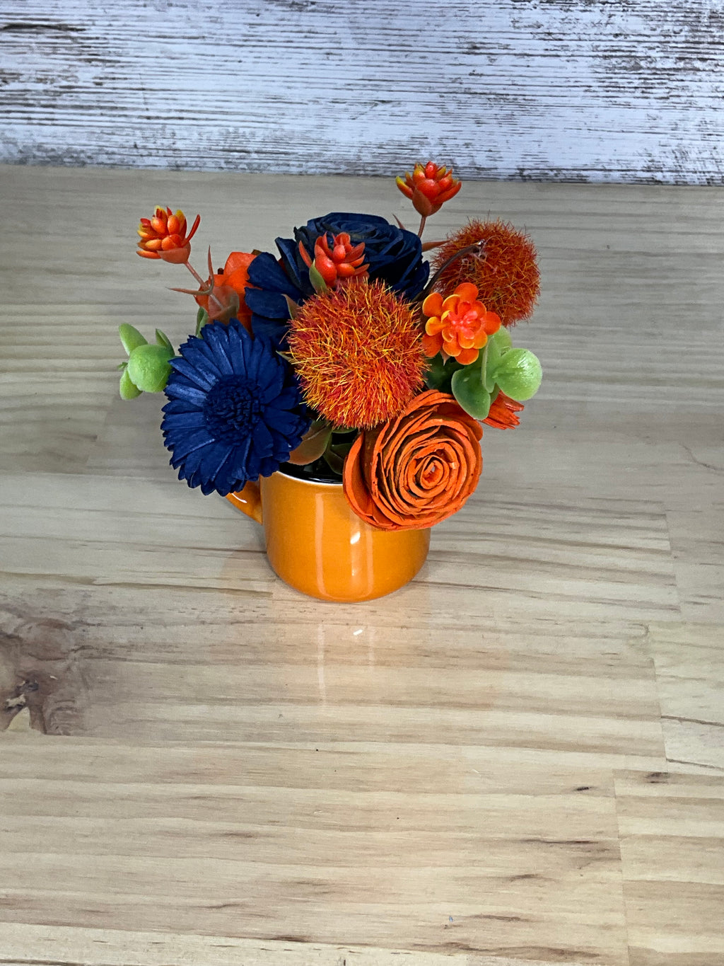 Navy & Orange Sola Wood Flower Arrangement in Glossy Orange Ceramic Mug