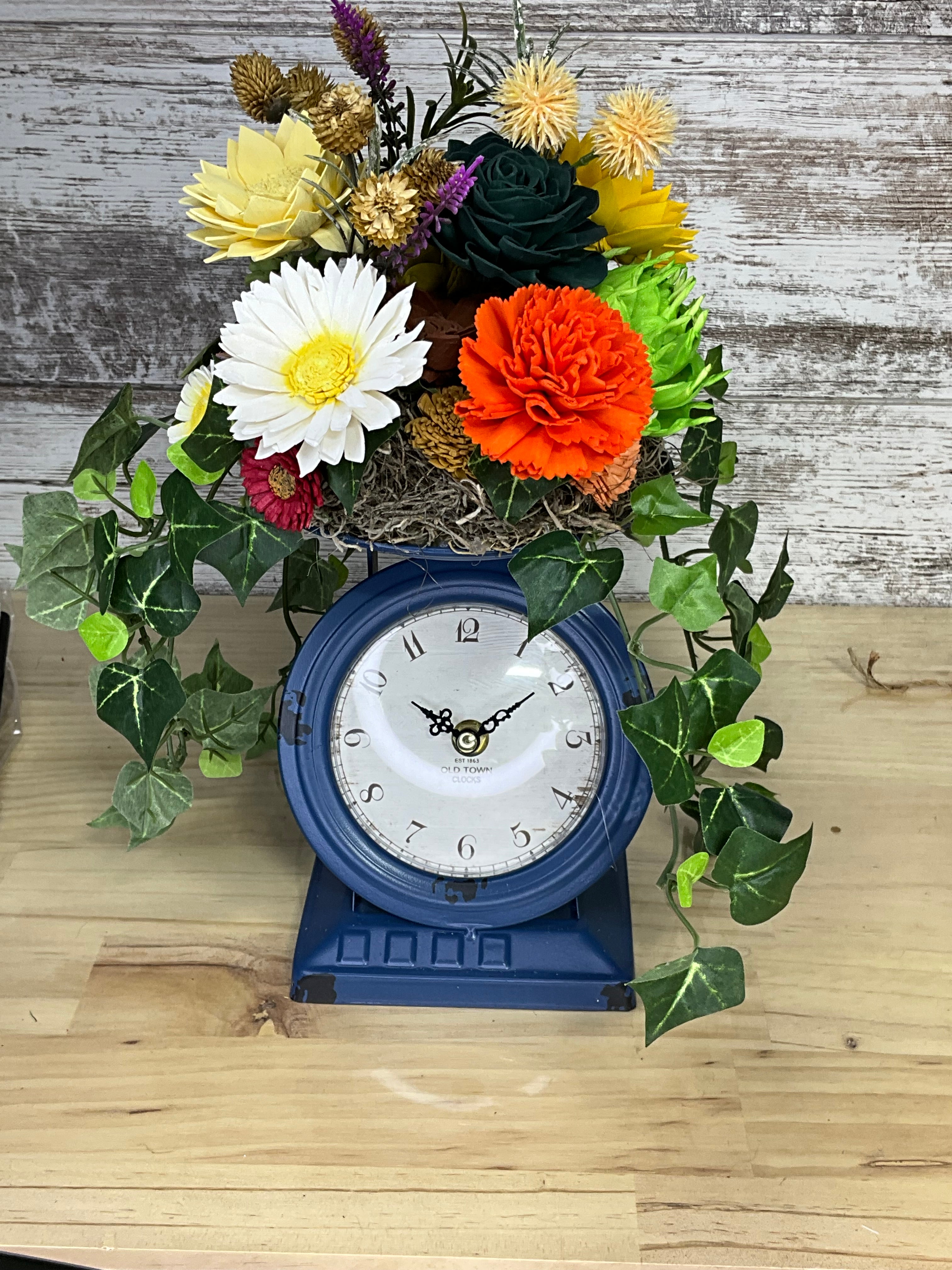 Sola Wood Flower Arrangement in Vintage Clock Vase