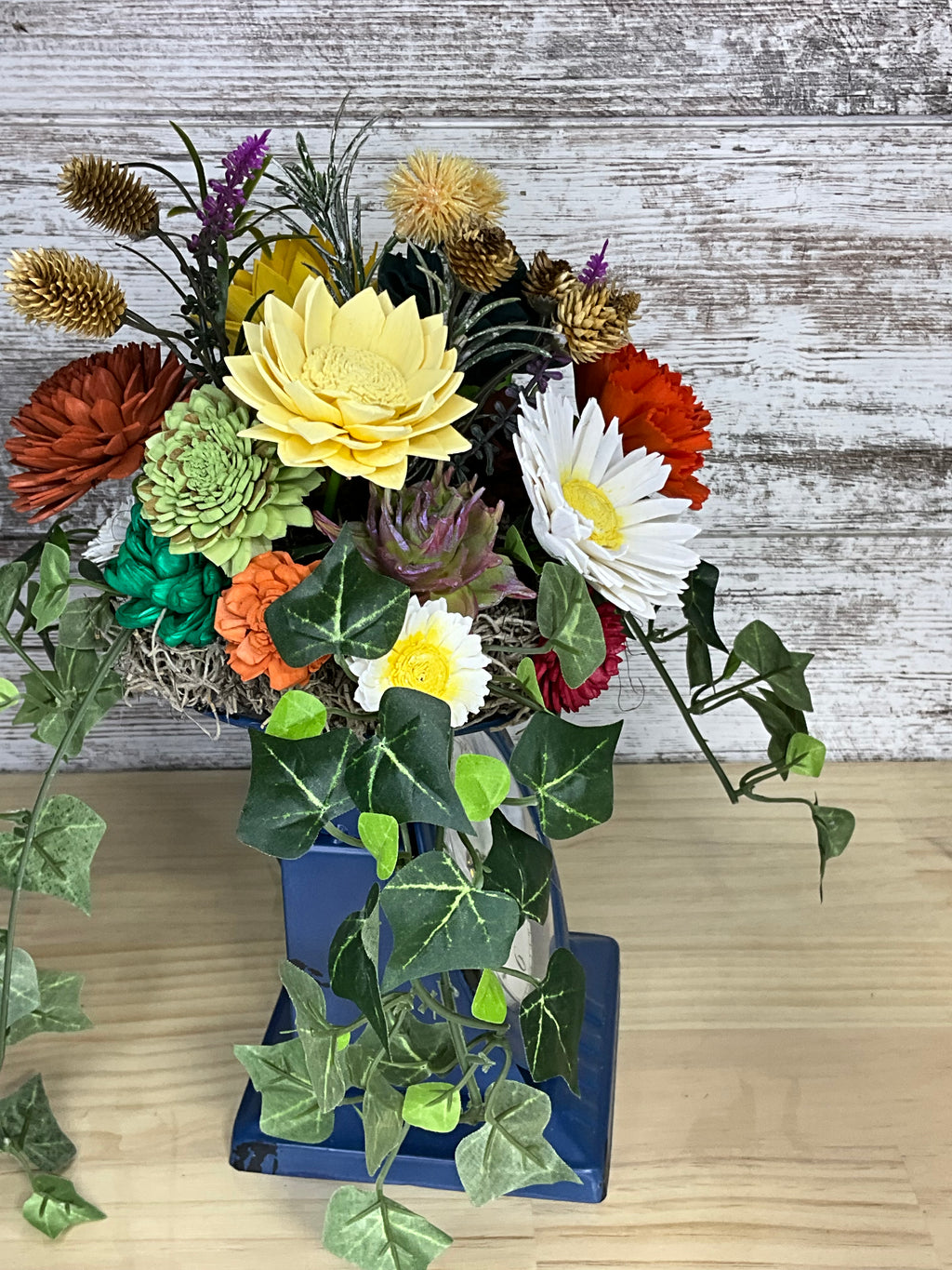 Sola Wood Flower Arrangement in Vintage Clock Vase